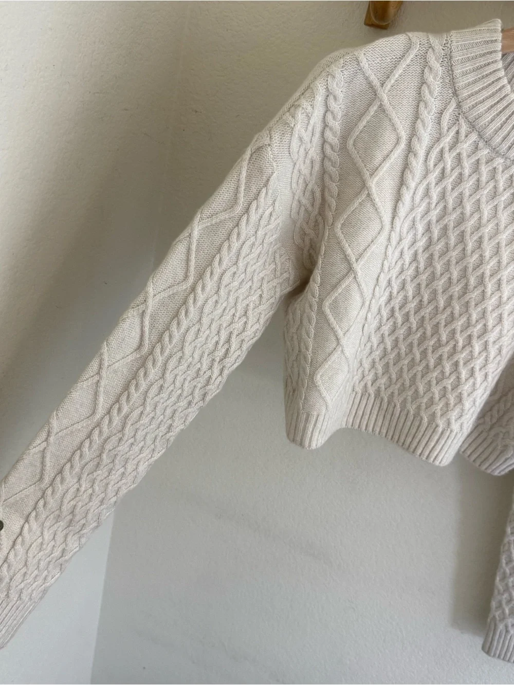 Clean girl capsule wardrobe minimalist preppy cream cable knit cropped sweater